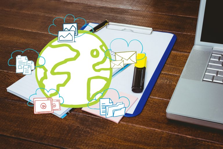 Composite image of a laptop and clipboard put on a wooden desk with icons